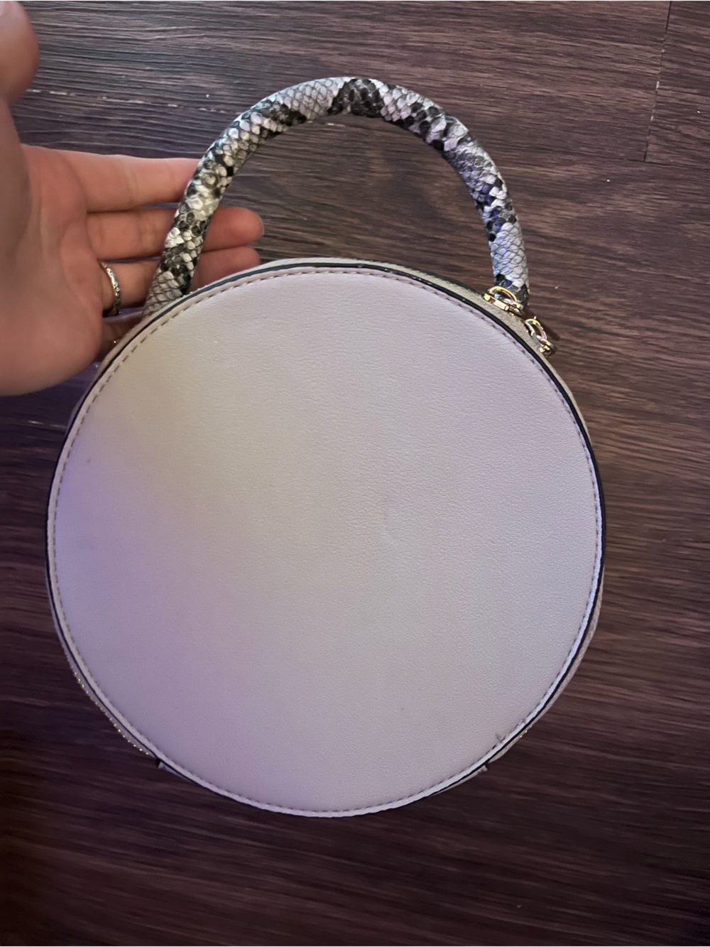 Light gray, and faux gray and black snake skin. Super cute! Circle